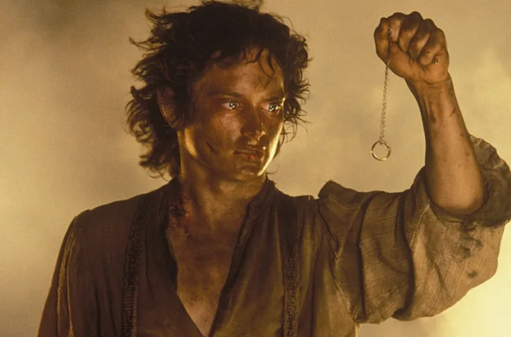 Frodo holding the Ring of Power 
