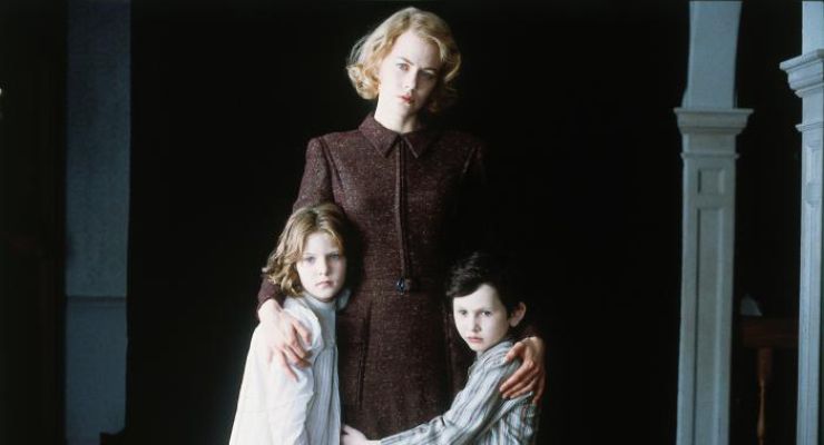 Nicole Kidman and two kids looking at the camera